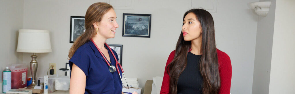 Doctor discussing health concerns with a patient in a clinic