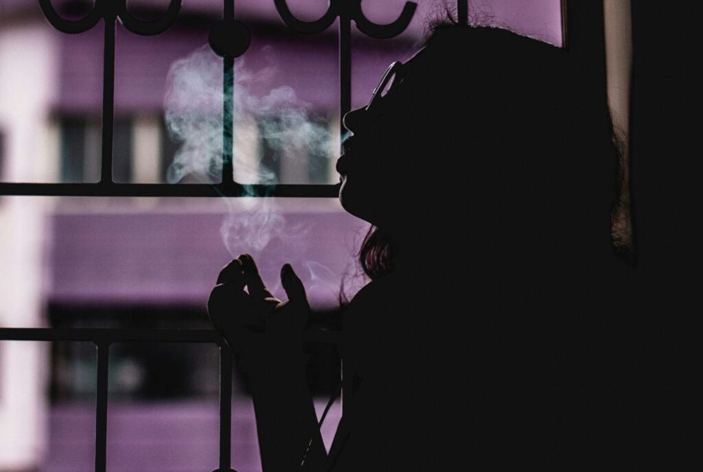 Silhouette of Woman Smoking